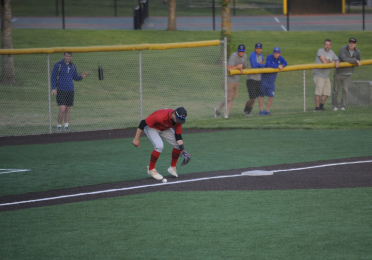 Senior 3rd baseman Shane Jameson patiently allows a ball to roll foul during a 3-1 win over Auburn Mountainview at Propstra Stadium in Vancouver.