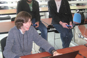 Camas High School (CHS) students Sage Emberlin (left), Simranjit Bhella (middle) and Conner Brown play "Brawlhalla" at CHS on May 16. 