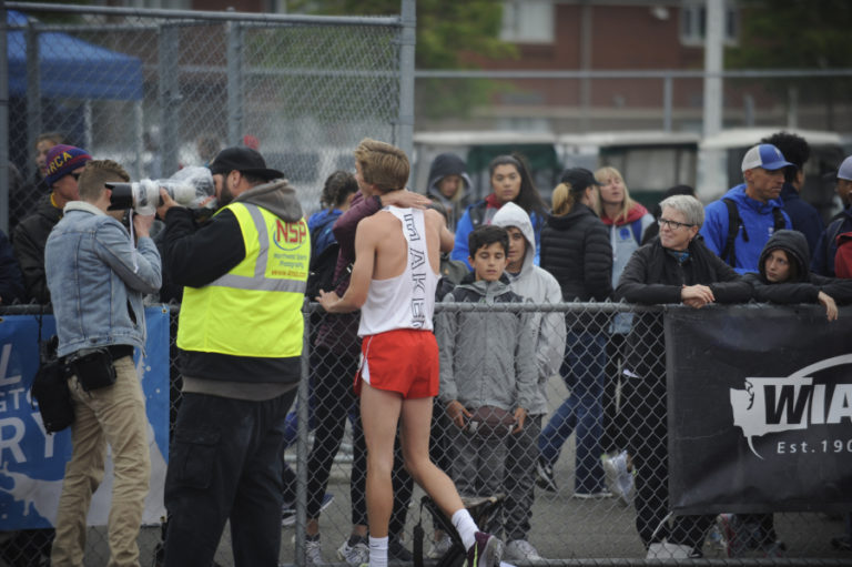 Camas senior runner Daniel Maton hugs his mother Michelle after winning his sixth state championship.