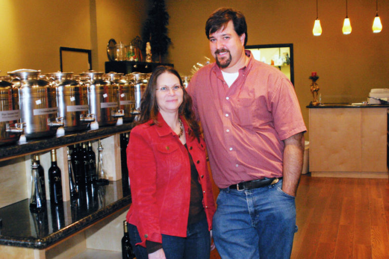 Dore and Don Blaske, owners of Naturally Healthy Pet in downtown Camas, will celebrate with other 10-year business owners on June 7. At top, Ed Fischer, owner of Camas Bike &amp; Sport, hangs a &quot;10 Years Strong&quot; poster inside his downtown Camas shop, advertising the 10-year-anniversary celebration he and three other business owners are hosting from 4 to 8 p.m., Friday, June 7, at the bike shop&#039;s parking lot off Northeast Fifth Avenue in Camas.