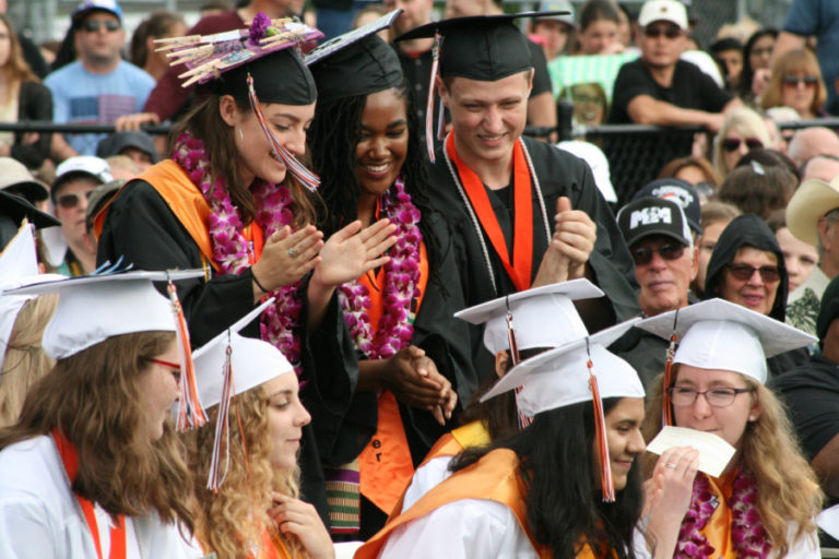 Washougal High class of 2018 graduates get hit with rain during a sudden thunderstorm at Fishback Stadium on June 16, 2018.
