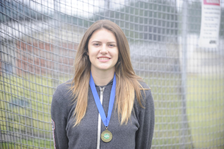 Washougal High School senior Kiersten De La Rocha wears the gold medal that she earned after throwing the discus father than any other 2A girl in the state.