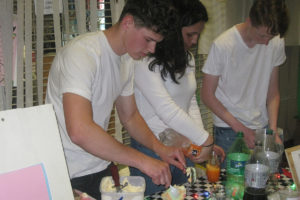 Camas High School students Andrew Okerlund (left), Pamela Jaramillo and Owen Leffel prepare floats during the "Thirsty Thursday" event June 6 at the school. (Photos by Doug Flanagan/Post-Record)