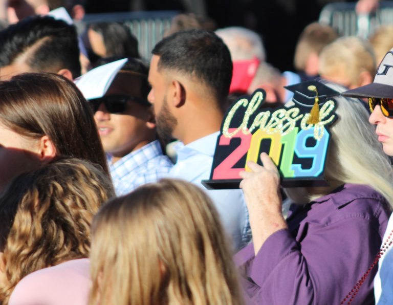 (Photo by Kelly Moyer/Post-Record)
An attendee at the June 14 Camas High School class of 2019 graduation shields their face from the bright, late afternoon sun.