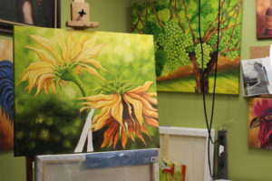 Sunflowers are the theme of Camas artist Liz Pike's July art show at the Camas Gallery. Here, a nearly finished piece waits for Pike's final touches at an art studio located on the former legislator's Fern Prairie farm.