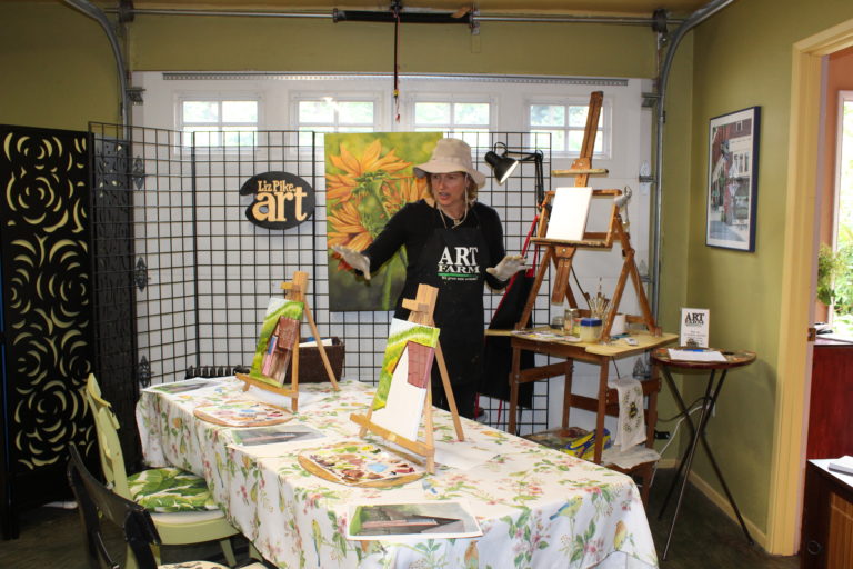 Former state legislator Liz Pike shows the space on her “art farm” that she has transformed into an art education classroom. Pike offers “Sip & Paint” classes for small groups throughout the year. Her most recent class is working on an oil painting of an old building with an American flag on it. “Great for the Fourth of July,” Pike said. Most of Pike’s paintings are inspired by nature and the scenes she sees around her at her Shangri-la Farm, located in Fern Prairie north of Camas. She said she typically works from a photograph and nearly always paints with oils on canvas.