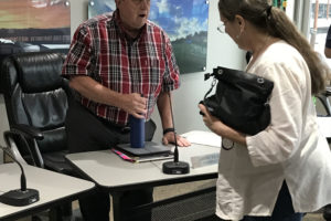 Port of Camas-Washougal commissioner Larry Keister (left) talks with Washougal resident Martha Martin after a July 1 meeting. Keister and Martin are members of a steering committee that will propose the formation of a performing arts and cultural center on the Washougal waterfront.