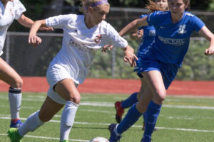 Ellie Schmid (second from left) in action with the Washington Timbers in the 2018 NWPL title match against the Seattle Stars.  The Timbers scored off this shot but eventually lost 3-1. (Contributed photo courtesy of Washington Timbers FC)