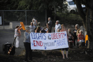 At least 125 people gathered outside the Camas Friends Church in downtown Camas on Friday, July 12, for a vigil addressing abuses against migrant families in government-run detention centers on the southern United States border. (Photos by Wayne Havrelly/Post-Record)