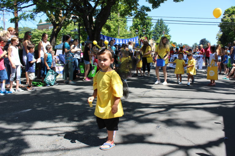 (Photo by Kelly Moyer/Post-Record) A child makes his way down Northeast Fourth Avenue in Camas during the 2019 Camas Days Kids Parade on Friday, July 26.
