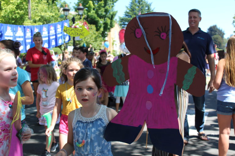 (Post-Record file photo) Children carry "Candyland" themed decorations down Northeast Fourth Avenue in downtown Camas during the July 2019 Camas Days Kids Parade.