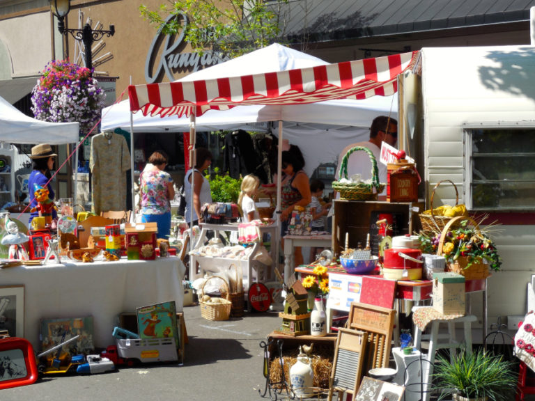Shoppers peruse the assortment of vintage home and garden goods at a past Vintage &amp; Art Faire in downtown Camas. This year's event will be held from 9 a.m. to 3 p.m., Saturday, Aug.