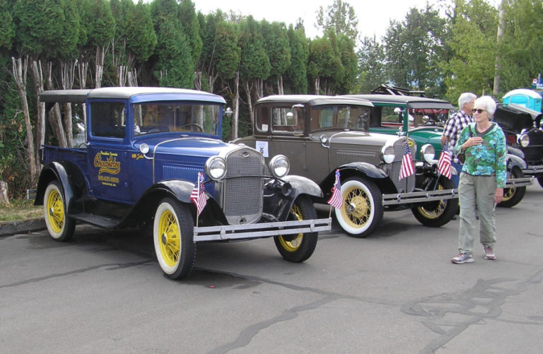 Attendees of the 2018 Heritage Day event at the Two Rivers Heritage Museum in Washougal walk past a Flying Eagle classic car display. This year's Heritage Day festivities will take place Saturday, Sept.