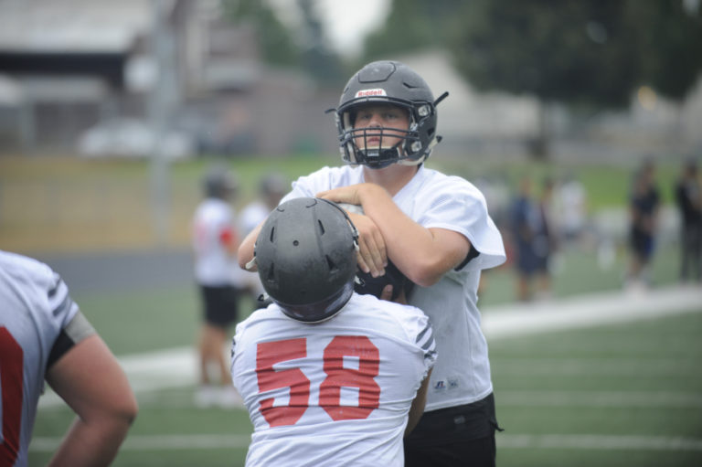 Camas High School lineman Rush Reimer participates in an acttivity during the first practice of the season.
