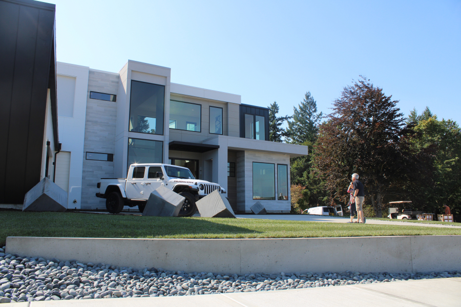 Visitors walk toward The Nakshatra home, by Axiom Luxury Homes, during the first day of the 2019 NW Natural Parade of Homes on Friday, Sept. 6, at Dawson's Ridge in Camas.