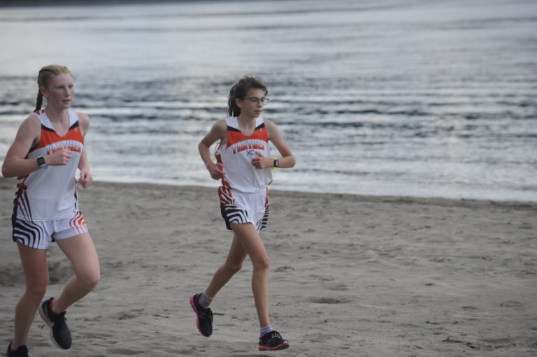 Washougal High School ophomore Savea Mansfield (left) and freshman Sidney Boothby lead all runners in the Panthers' first home race of the season at Captain William Clark Park on Sept. 18.
