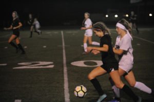 Washougal High School freshman Olivia Buck controls the ball during a fast break against R.A. Long High School on Sept. 17. (Wayne Havrelly/Post-Record)
