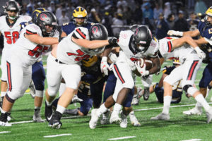 Junior running back Jacques Badolato-Birdsell takes advantage of a hole created by the Camas offensive line during a game against Bellevue on Friday, Sept. 27. (Contributed photo by Kris Cavin)