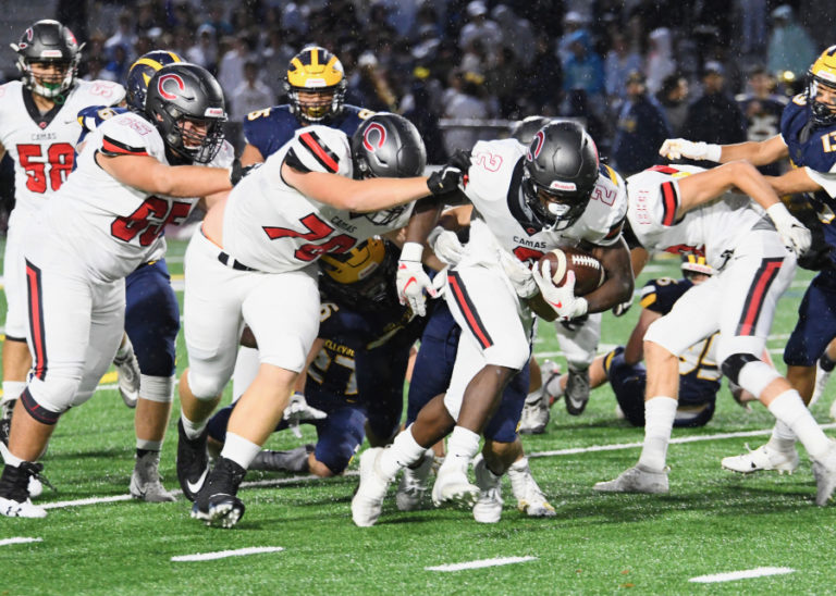 Junior running back Jacques Badolato-Birdsell takes advantage of a hole created by the Camas offensive line during a game against Bellevue on Friday, Sept. 27.