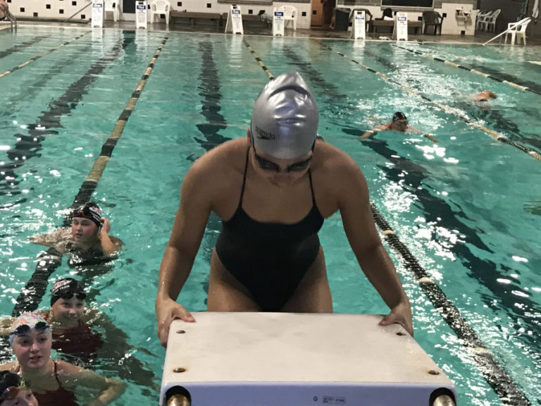 Camas High School senior swimmer Bailey Segall practices the backstroke during a practice session at Cascade Athletic Club in Vancouver.