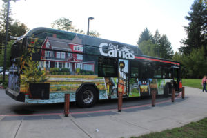 A C-Tran bus highlighting the city of Camas on one side, the Camas lily on the back and the Camas School District on another side sits outside the Lacamas Lake Lodge during the 2019 Camas State of the Community address on Sept. 19, 2019. (Kelly Moyer/Post-Record files)