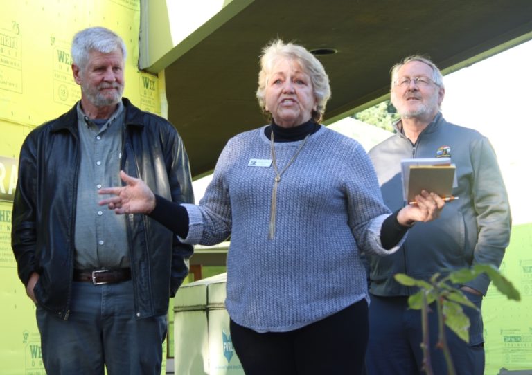 Washougal mayor Molly Coston (center) speaks at the unveiling ceremony for the &quot;White Wing&quot; mural at Washougal Community Library on Wednesday, Oct. 9, flanked by Washougal Arts and Cultural Alliance president Jim Cooper (left) and Washougal city council member Paul Greenlee. &quot;This is a very important piece of art for our community as a whole,&quot; she said. &quot;We don&#039;t really know very much about history in our community. We know much less about women in history. And we know even much less than that about Native men and women in our local history.