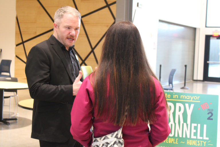 Barry McDonnell, a write-in candidate for the Camas mayoral seat (left) talks to a consituent at the Youth Advisory Council&#039;s 17th annual candidate forum, held Oct.