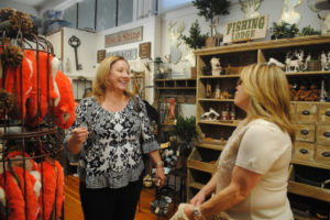 Camas Mayor Shannon Turk (left) chats with Kristen Danis at Camas Antiques in October 2018, a few weeks before Camas City Council members appointed her to be the next mayor of Camas. (Post-Record file photos)