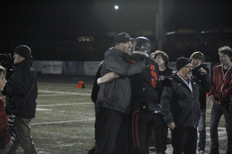 Camas High School senior quarterback Blake Ascuitto receives hugs after the Papermakers' 28-14 win over Union High School on Nov. 1. Ascuitto started for the first time this season after Jake Blair suffered a broken collarbone in an Oct. 24 game against Skyview High School.