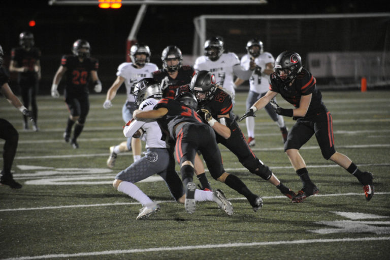 Camas High School defensive players swarm a Union High School running back during the Papermakers' 28-14 victory at Doc Harris Stadium in Camas on Nov. 1.