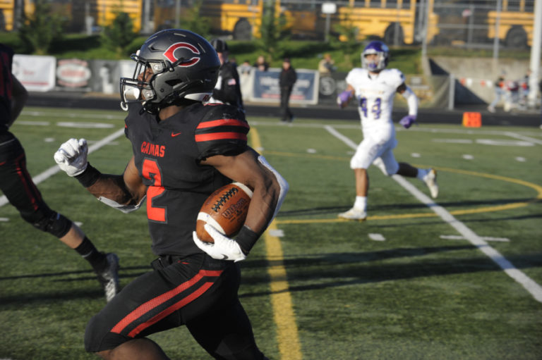 Photos by Wayne Havrelly/Post Record 
 Junior Jacques Badalto-Birdsell sprints for one of his two touchdowns against Puyallup.  He rushed 20 times for 185 yards.