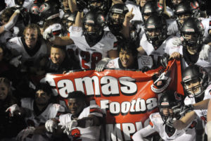 The Camas High School football team celebrates after beating Bothell High School 35-14 in the 4A state championship game at Mount Tahoma Stadum in Tacoma on Dec. 7. The victory capped off an undefeated season and gave the Papermakers their second state title in the past four years. (Post-Record file photos)