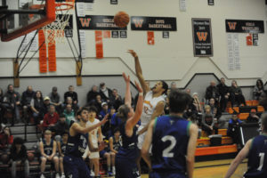 Washougal High School freshman Yanni Fassalis glides between two Columbia River High School defenders during a Dec. 9 game. (Photos by Wayne Havrelly/Post-Record)