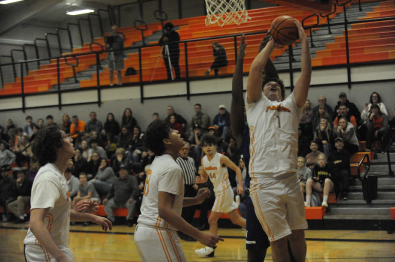 Washougal High School senior captain Jakob Davis yells out a play while making a long outlet pass against Mountain View High School on Dec. 9.