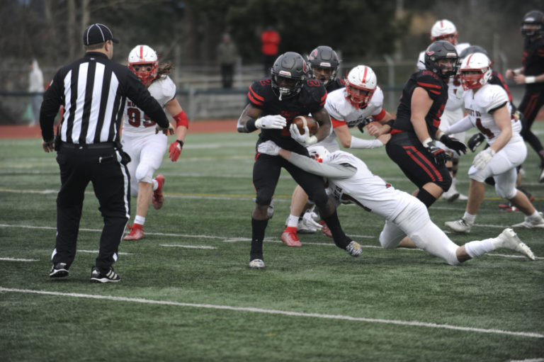 Camas High School junior Jacques Badolato-Birdsell escapes a tackle for a big gain against Mount Si High School on Nov. 30 at McKenzie Stadium.