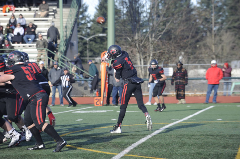 Camas High School senior Blake Asciutto uses the east wind to his back to throw an 80-yard touchdown pass to Jackson Clemmer on the Papermakers&#039; first offensive play against Mount Si High School in a 4A state tournament semifinal game at McKenzie Stadium in Vancouver on Nov. 30.