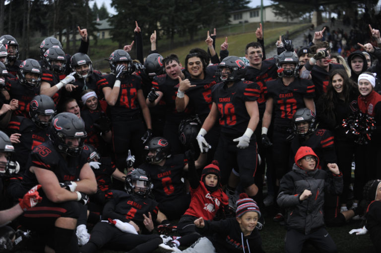 Onto the finals. Camas High School football players raise the No. 1 sign after beating Mount Si High School at McKenzie Stadium on Nov.