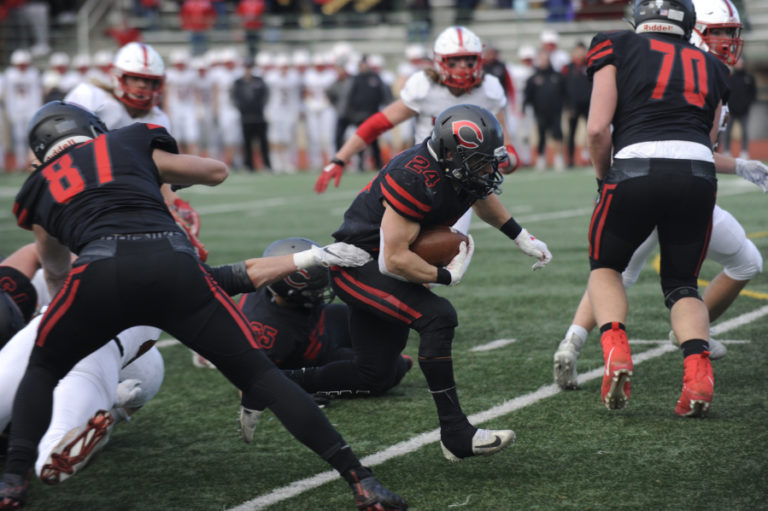 Camas High School senior Randy Yaacoub finds a hole made by the Papermakers&#039; offensive line during their 4A state tournament semifinal game at McKenzie Stadium on Nov. 30. Yaacoub rushed nine times for 53 yards against Mount Si.