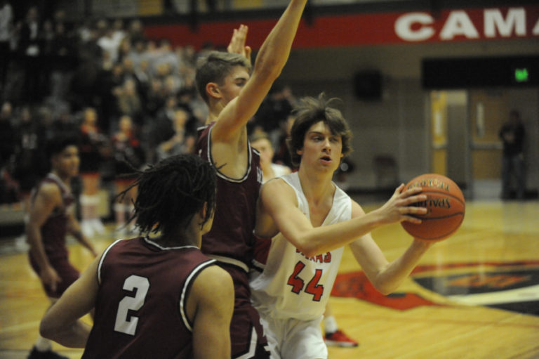 Camas High School junior Blake Bell looks to escape double coverage in the Papermakers' home opener on Dec. 5.