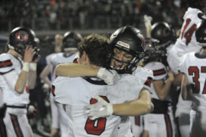 Camas High School seniors Charlie Bump and Martin Knysh share an emotional moment following the Papermakers' state championship victory over Bothell High School on Dec. 7. (Photos by Wayne Havrelly/Post-Record)