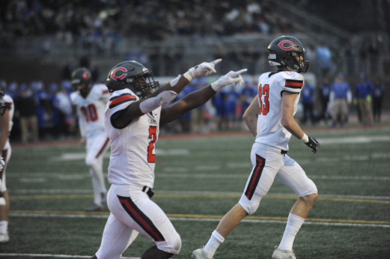 Camas High School junior Jacques Badaldo-Birdsell gestures to Papermakers fans after his third rushing touchdown in the 4A state championship game on Dec. 7 in Tacoma.