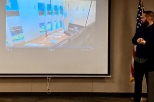 Octavio Gutierrez, an associate with Mahlum Architects, shows an illustration of the future Joyce Garver Theater lobby to the Camas school board on Monday, Jan. 13. (Kelly Moyer/Post-Record)
