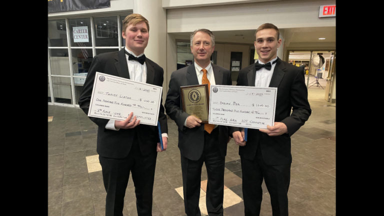 Washougal football players Tommy Liston (left) and Brevan Bea (right), along with Panthers coach Dave Hajek (center), display their awards during the Clark County Chapter of the National Football Foundation and College Hall of Fame awards banquet on Jan. 16 at Hudson's Bay High School.