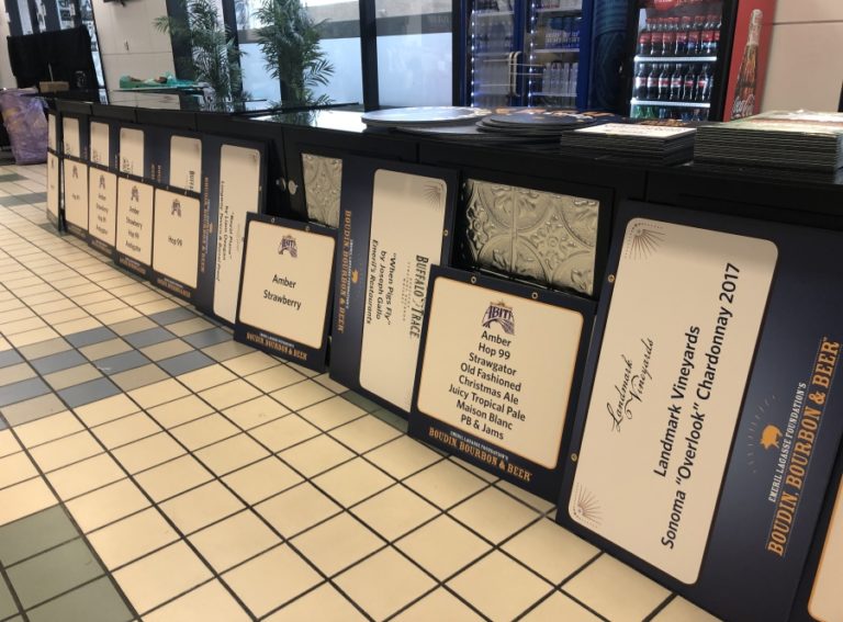 Contributed photo courtesy of Reed Creative 
 A collection of markeitng materials, designed by Washougal's Reed Creative for the Emeril Lagasse Foundation's annual fundraising weekend, are displayed in New Orleans in November 2019.