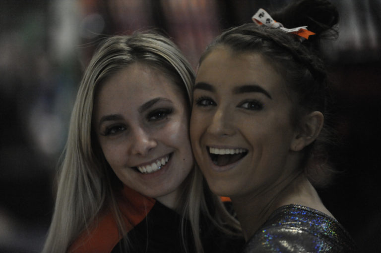 Washougal's Paris Krecklow (left) shows support for her teammate and friend Shaela Ausmus at the 1A/2A/3A state gymnastics meet in Bellevue on Feb. 21.