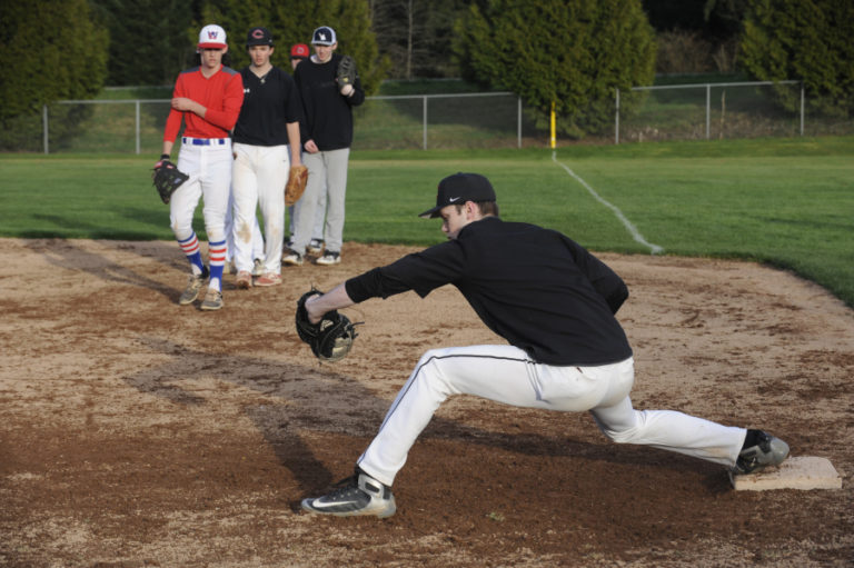 Camas senior Riley Sinclair practices his first-base skills  at a recent practice session. Sinclair is also the Papermakers' No. 1 pitcher this season.