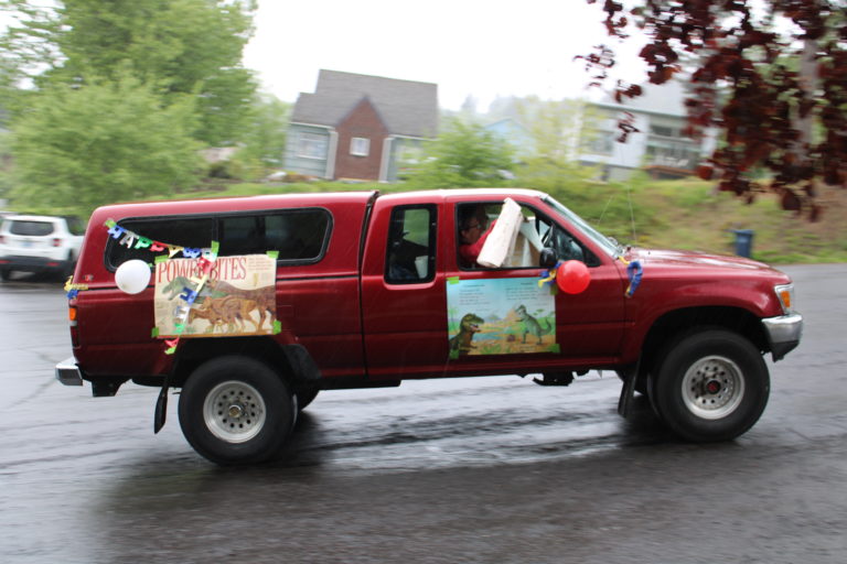 Vehicles drive by the Hergenroether home to celebrate Timothy Hergenroether's eighth birthday on Sunday, May 3.