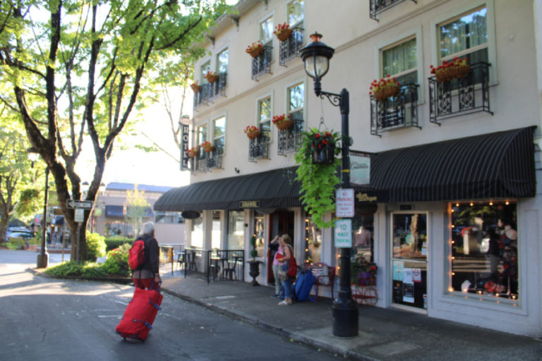 Guests enter the Camas Hotel in August 2019. The man who claimed to be the owner of the hotel, Won Dongandres Lee Kim, also known as &quot;Brendan Lee,&quot; has been charged with first-degree arson after allegedly setting fire to an unoccupied room while guests and employees were present in what police say was a bid to collect insurance money to repay a gambling debt.