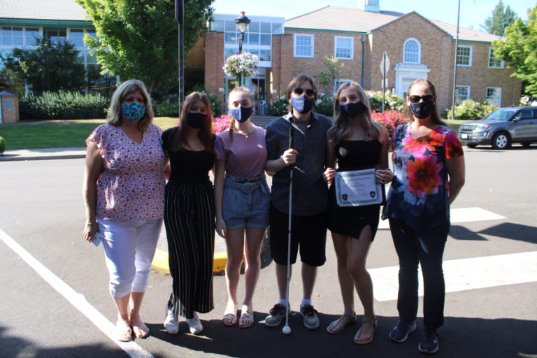 Hannah Salinas, of Vancouver, (second from right) stands with her family outside Camas City Hall on Aug. 7. Salinas was one of three Vancouver teens honored by Camas officials last week for her heroic rescue at the Camas Potholes in July. Pictured with Salinas from left to right: Kelly Petty, Olivia Tucker-Salinas; Salinas' father, Steven Salinas; Salinas; and Salinas' mother, Jennifer Cayabyab.