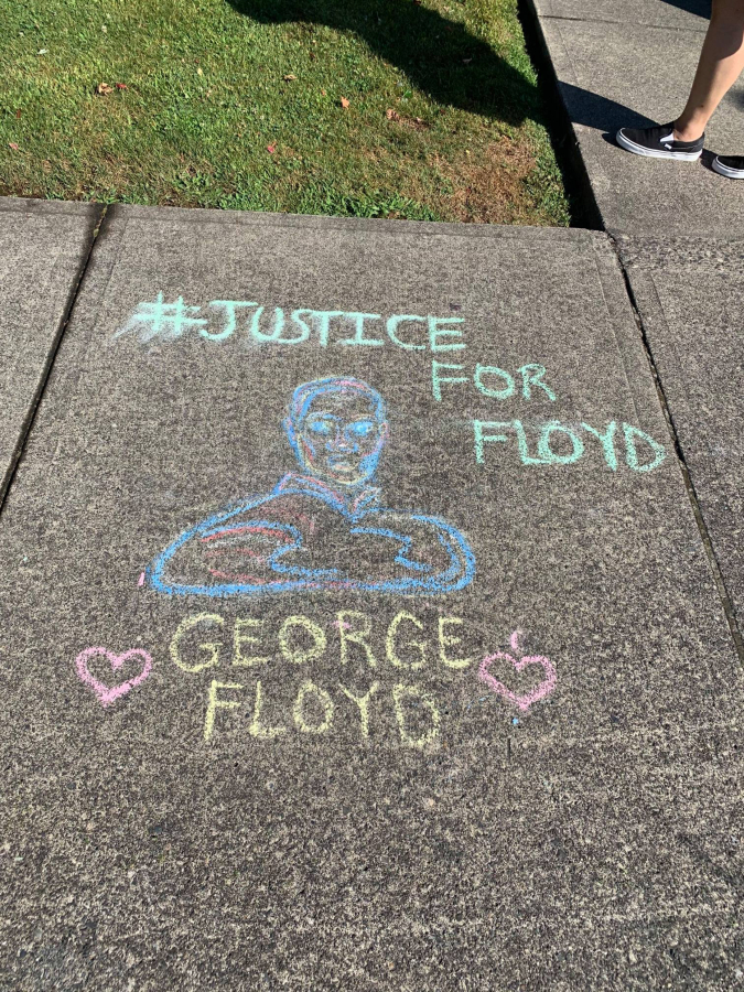An example of the type of public art drawn in chalk outside the Camas Public Library in July.